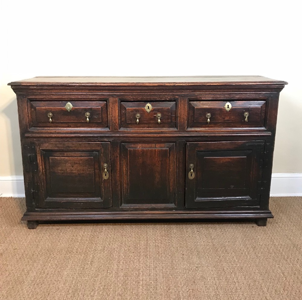 A rare Queen Anne pine dresser base circa 1710 with the original crusty patination