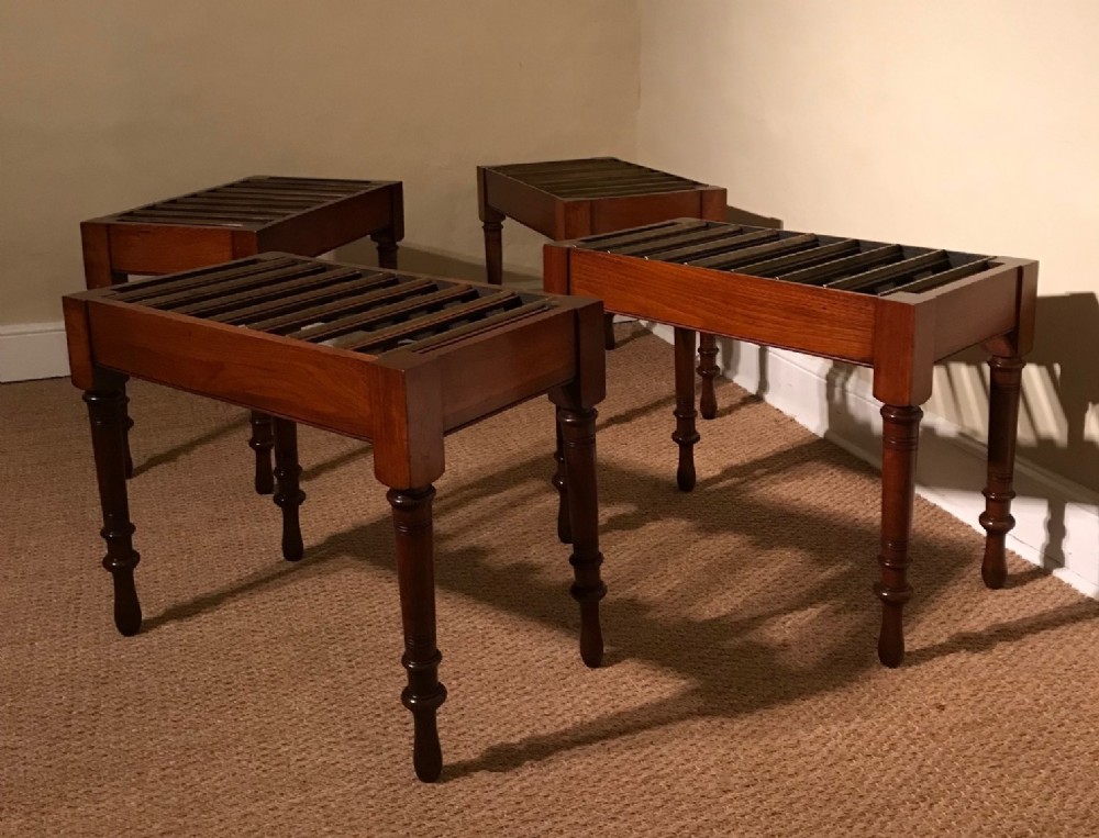 A set of four large Victorian walnut luggage racks circa 1890