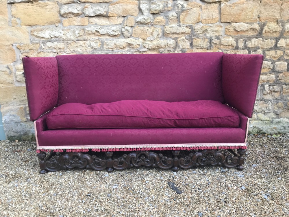 A large late Victorian oak knole sofa circa 1900 