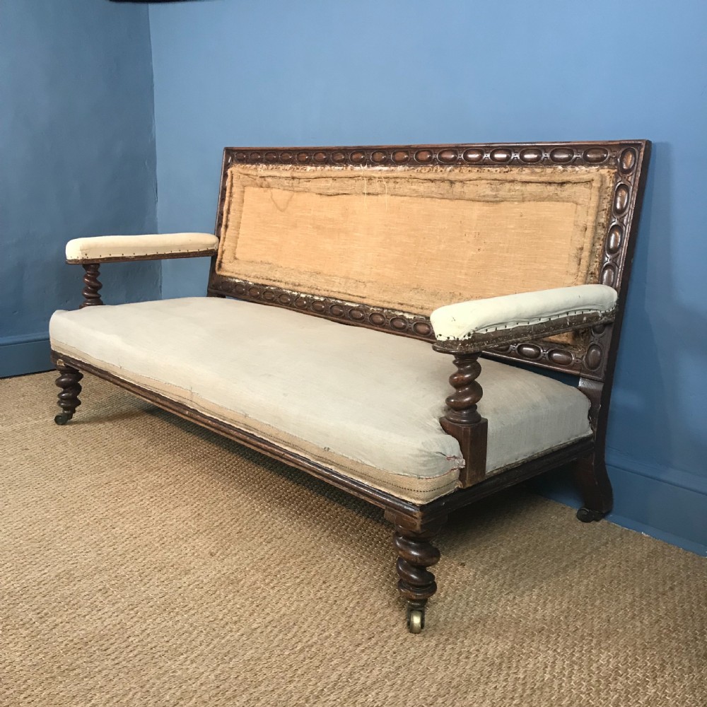 A Mid Victorian oak bobbin turned Sofa circa 1870 .