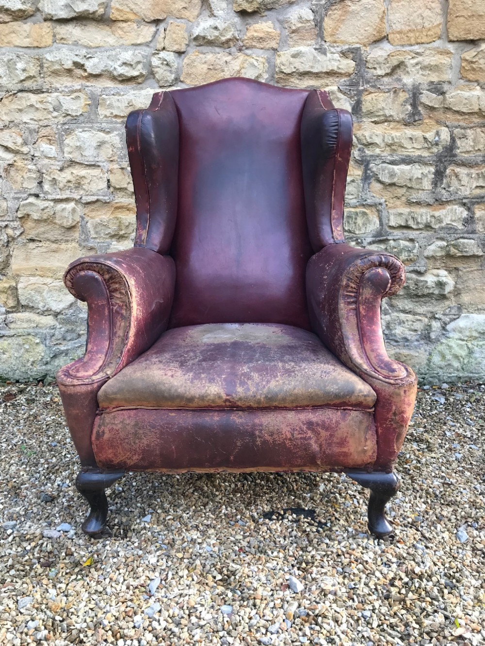 A large late Victorian leather wing back library chair circa 1890