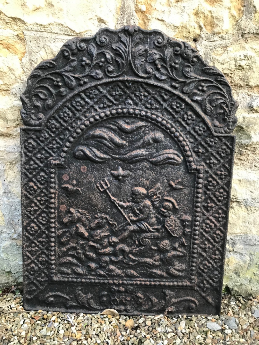 A late 19th c iron fire back c 1900 in 17th style