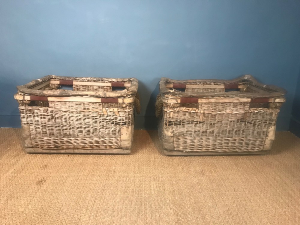 A pair of large late 19th c wicker baskets for logs