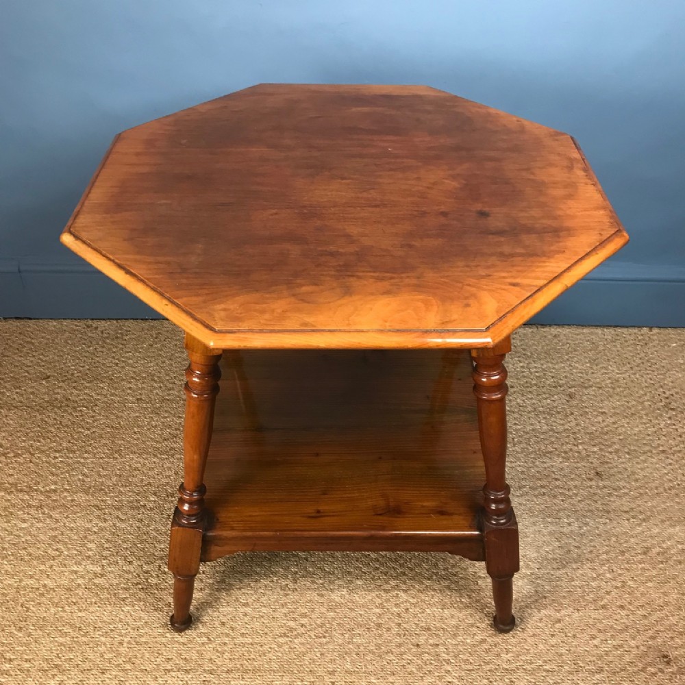 An octagonal walnut table c 1890 attributed to Morris and Co