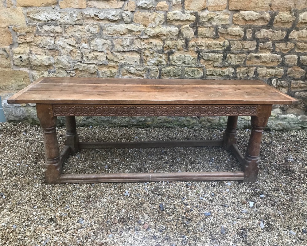 A large Arts and Crafts pale oak refectory table c 1910