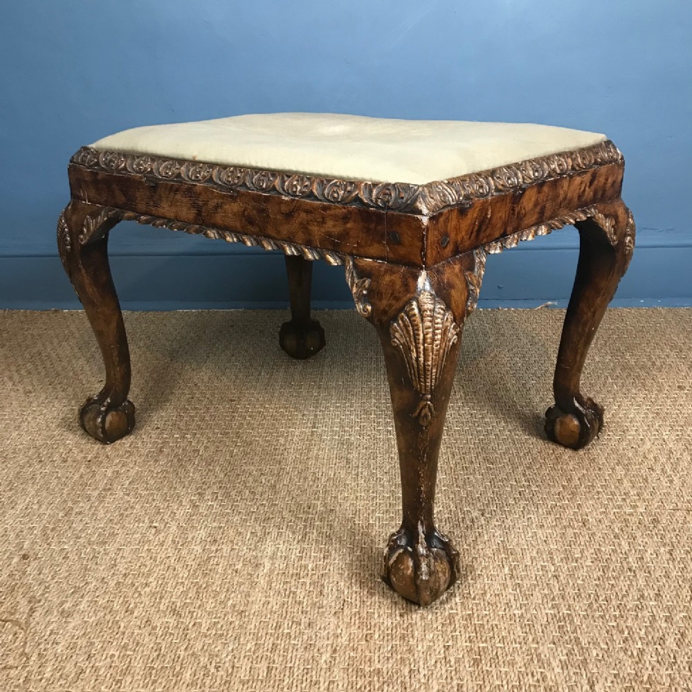 A George 1 style walnut and parcel gilt stool c 1900