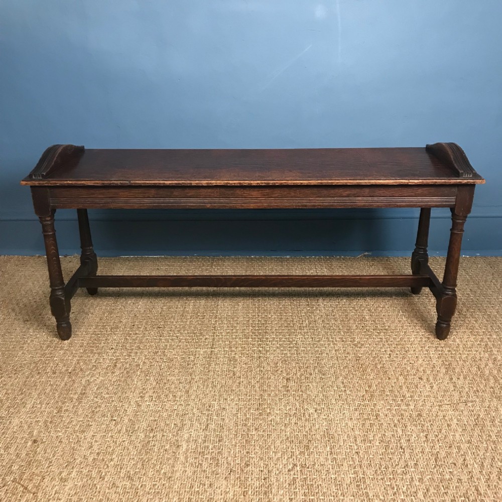 An Arts and Crafts oak hall bench c 1890
