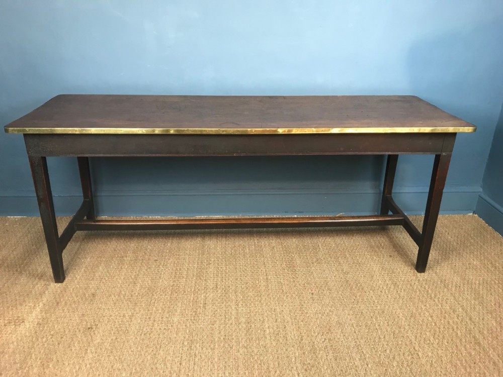 A Georgian mahogany and brass banded tavern table circa 1820