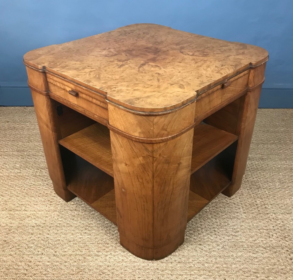 An Art Deco burr walnut book table circa 1930 by Maples