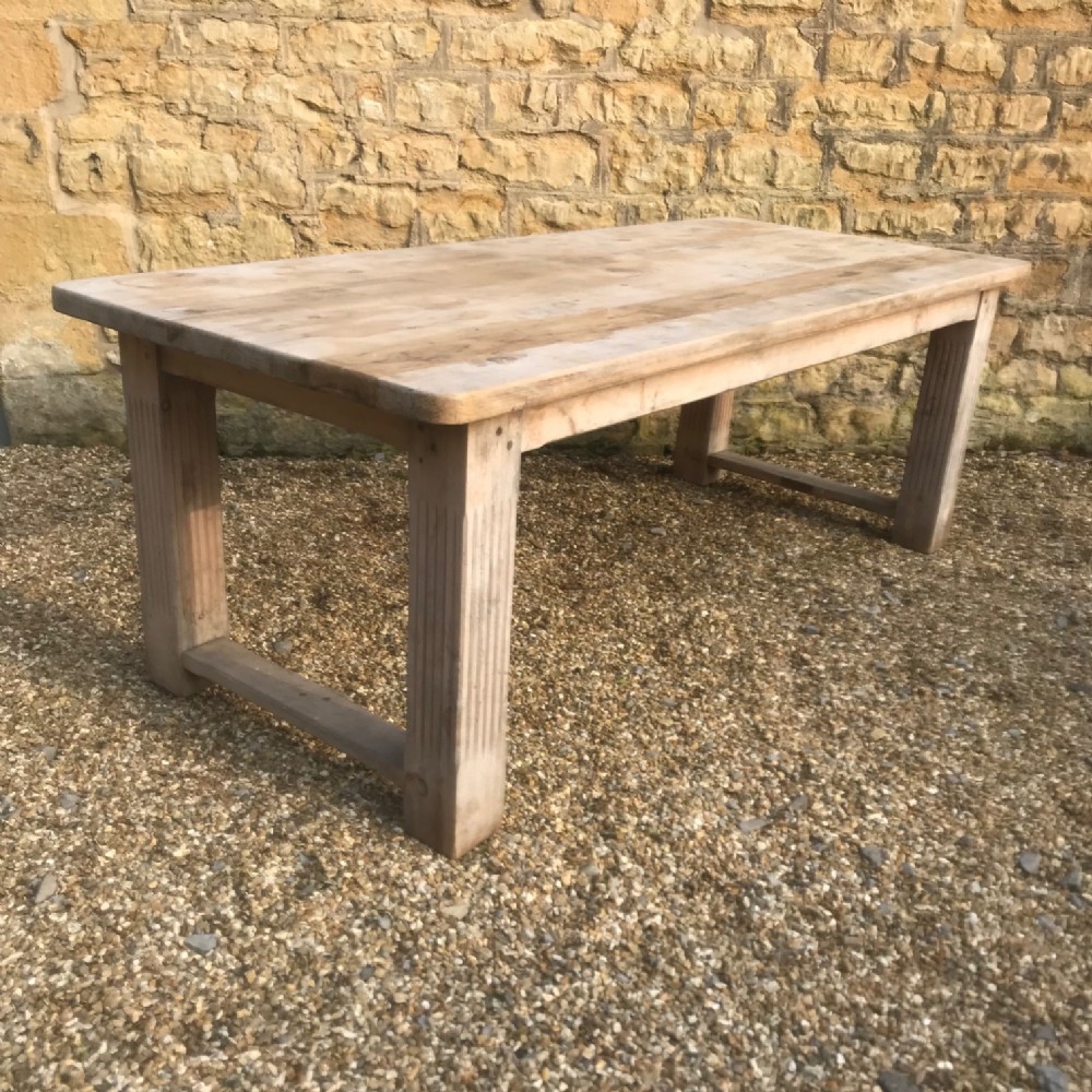 A large Arts and Crafts pine kitchen table circa 1910