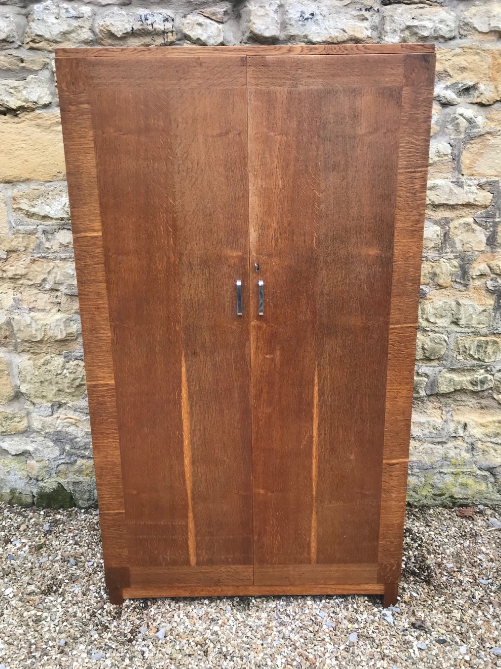A Heals oak 2 door wardrobe circa 1930