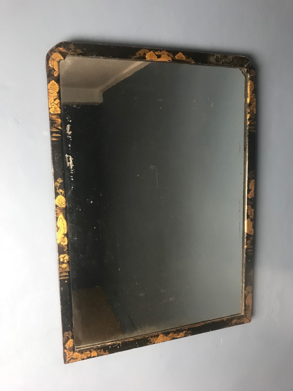 A small George 111 lacquer wall mirror circa 1770