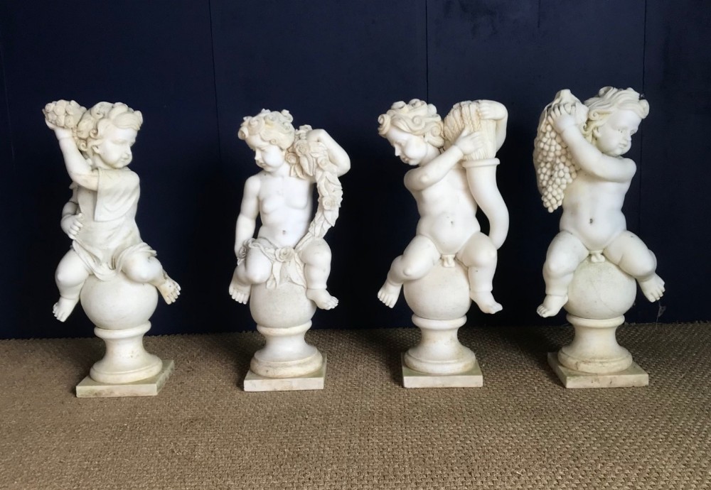 A set of 4 Italian marble statues of the Four Seasons circa 1930 .