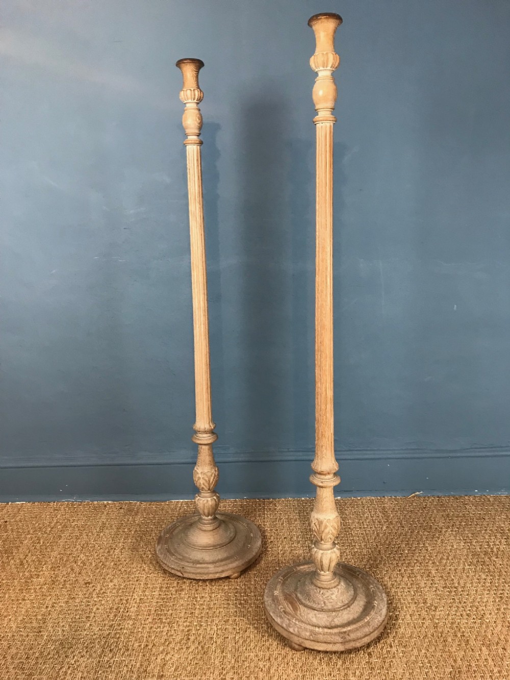 A pair of Heals design limed oak standard lamps circa 1930