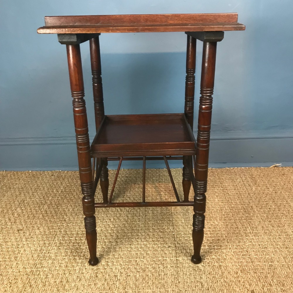 An Aesthetic Movement walnut 2 tier Godwin table circa 1880