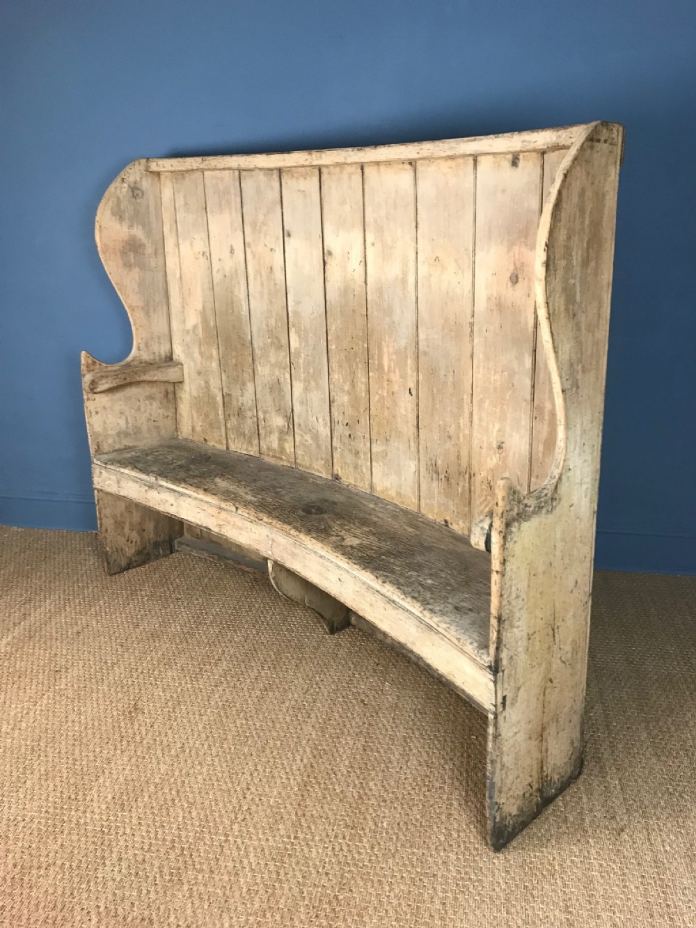 A late Georgian curved pine settle circa 1830 