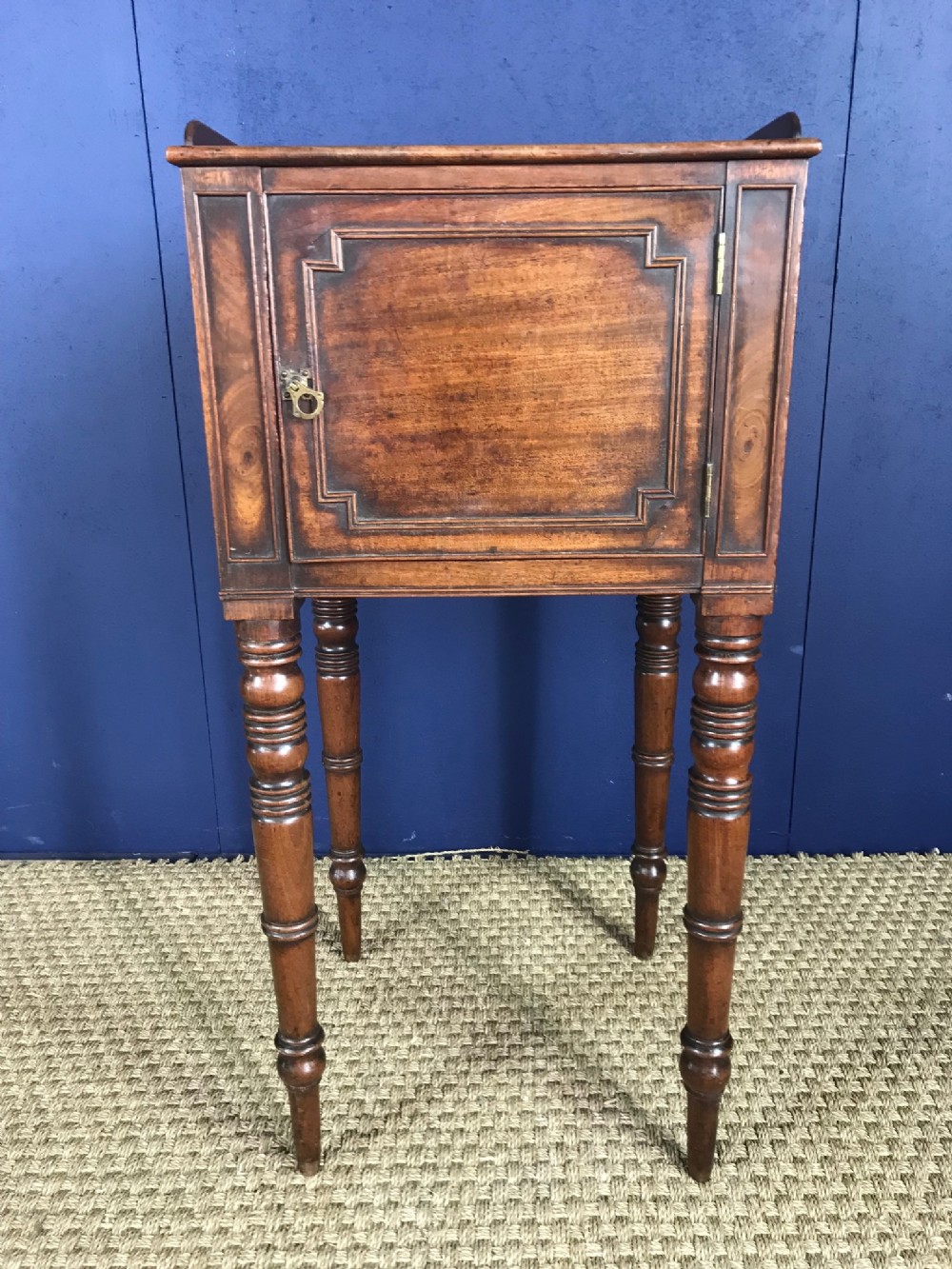 A George IV mahogany bedside table circa 1830