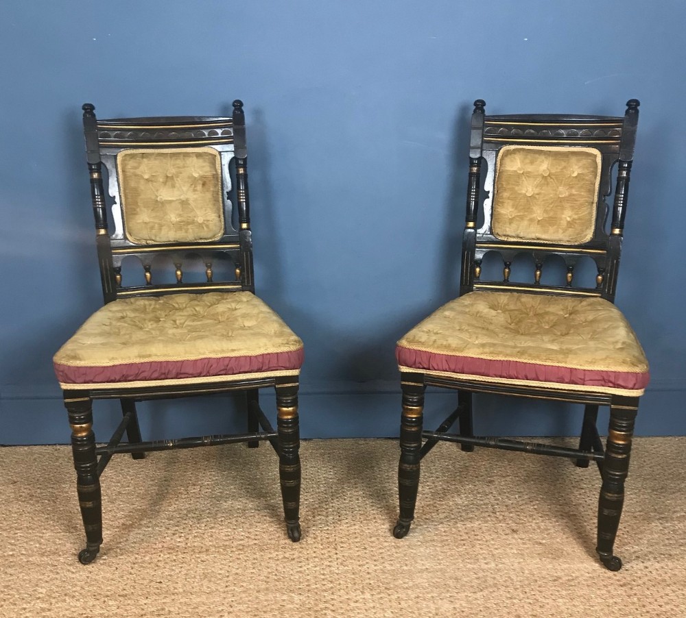 A pair of Aesthetic Movement ebonised side chairs circa 1880  with the original upholstery
