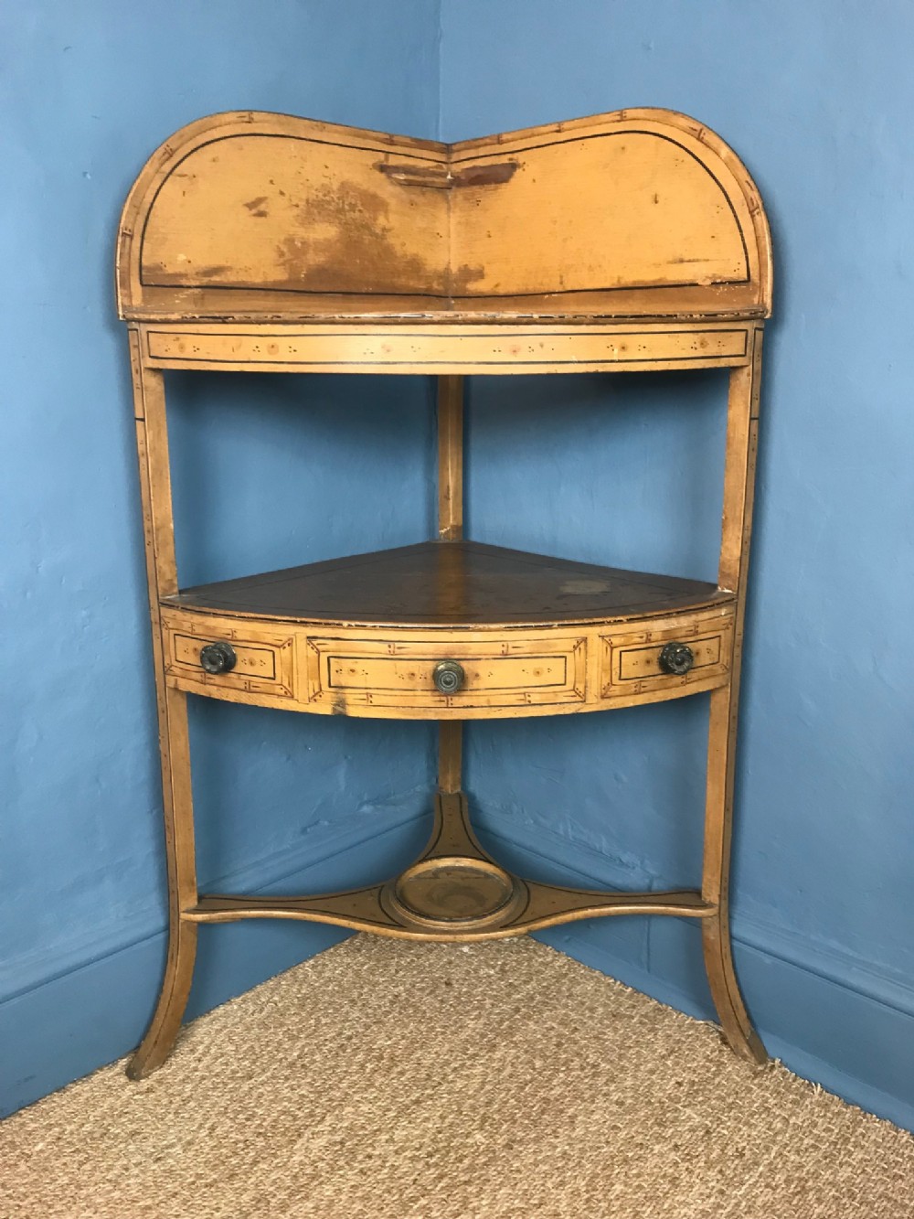 A Regency faux bamboo bow front  painted pine corner washstand circa 1830