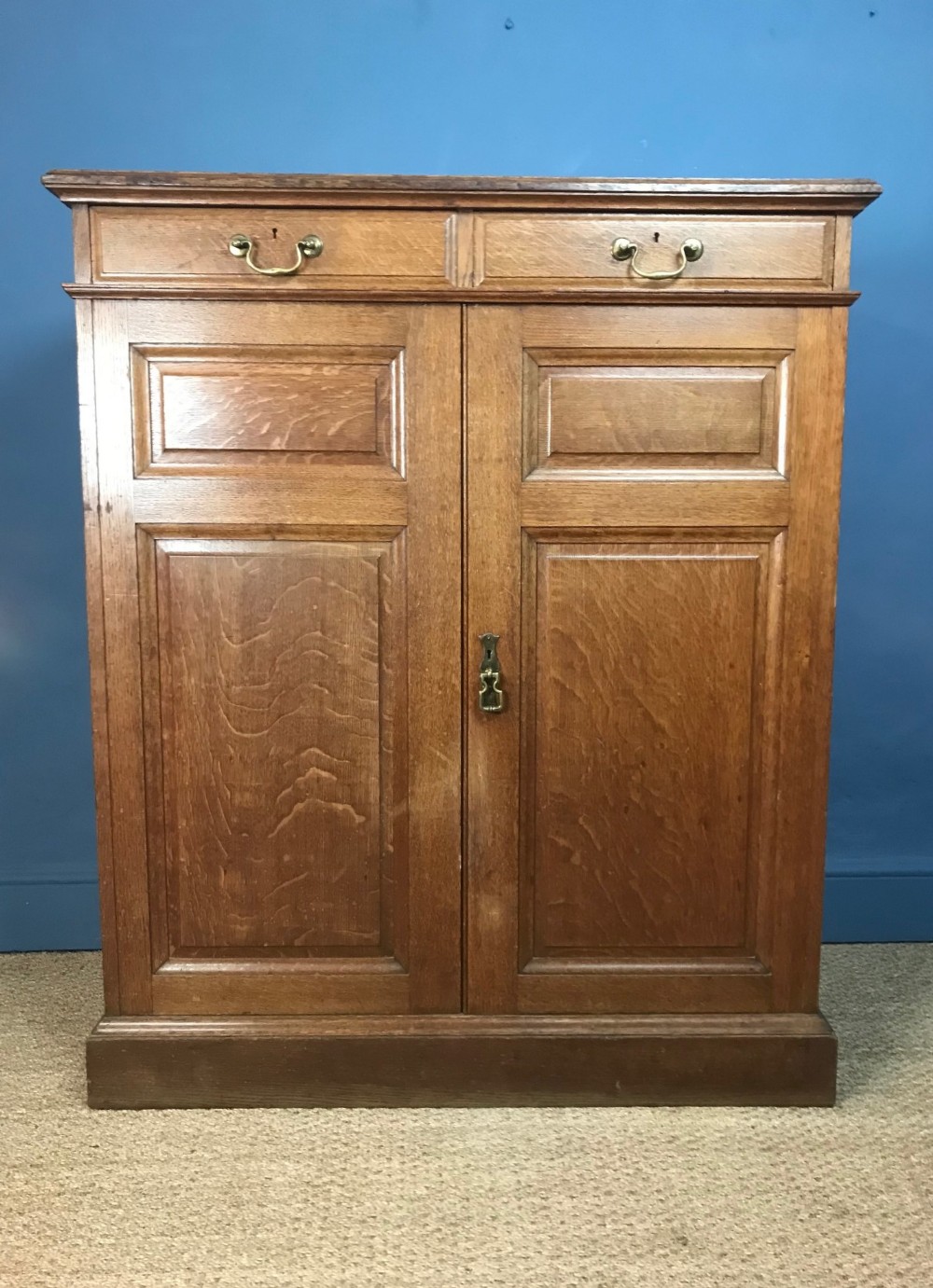 A Howard and Sons oak linen cupboard circa 1900 