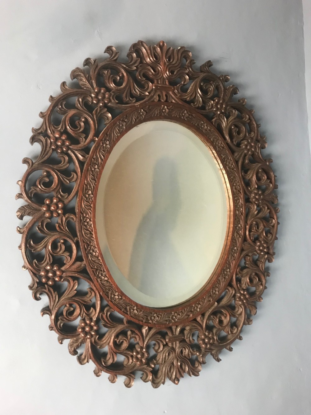 An Anglo Indian double sided teak oval mirror Bombay Presidency circa 1880