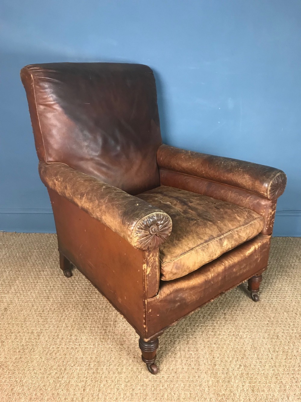 A large Victorian leather library armchair circa 1880