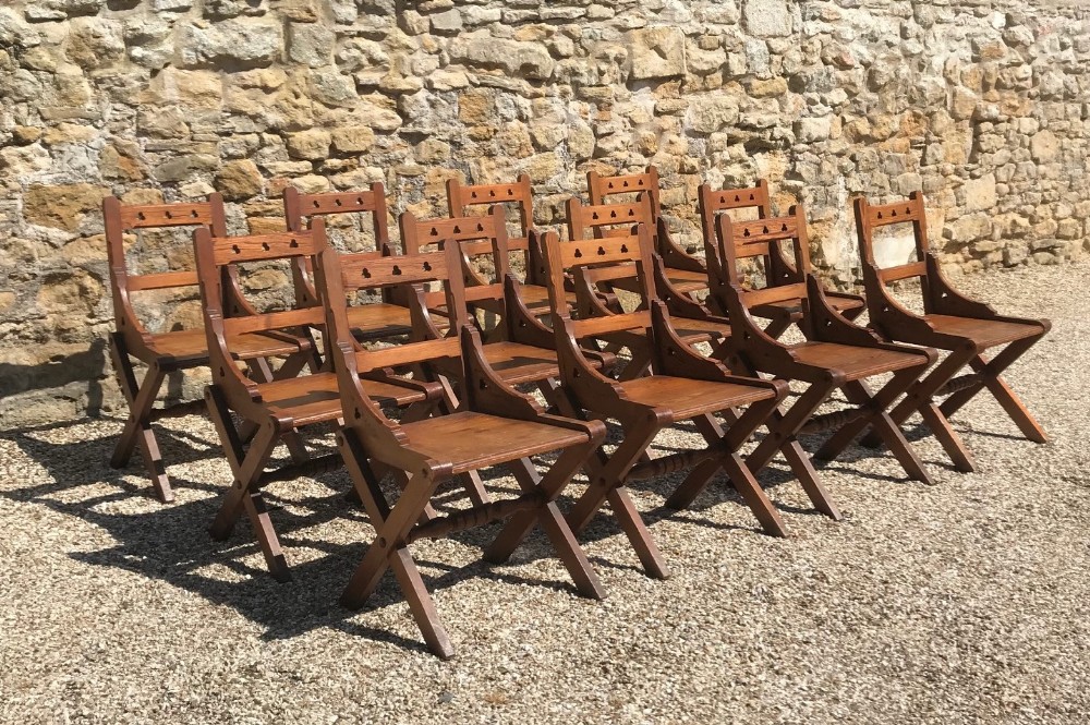A set of 12 Gothic Revival Oregon Pine chairs circa 1890