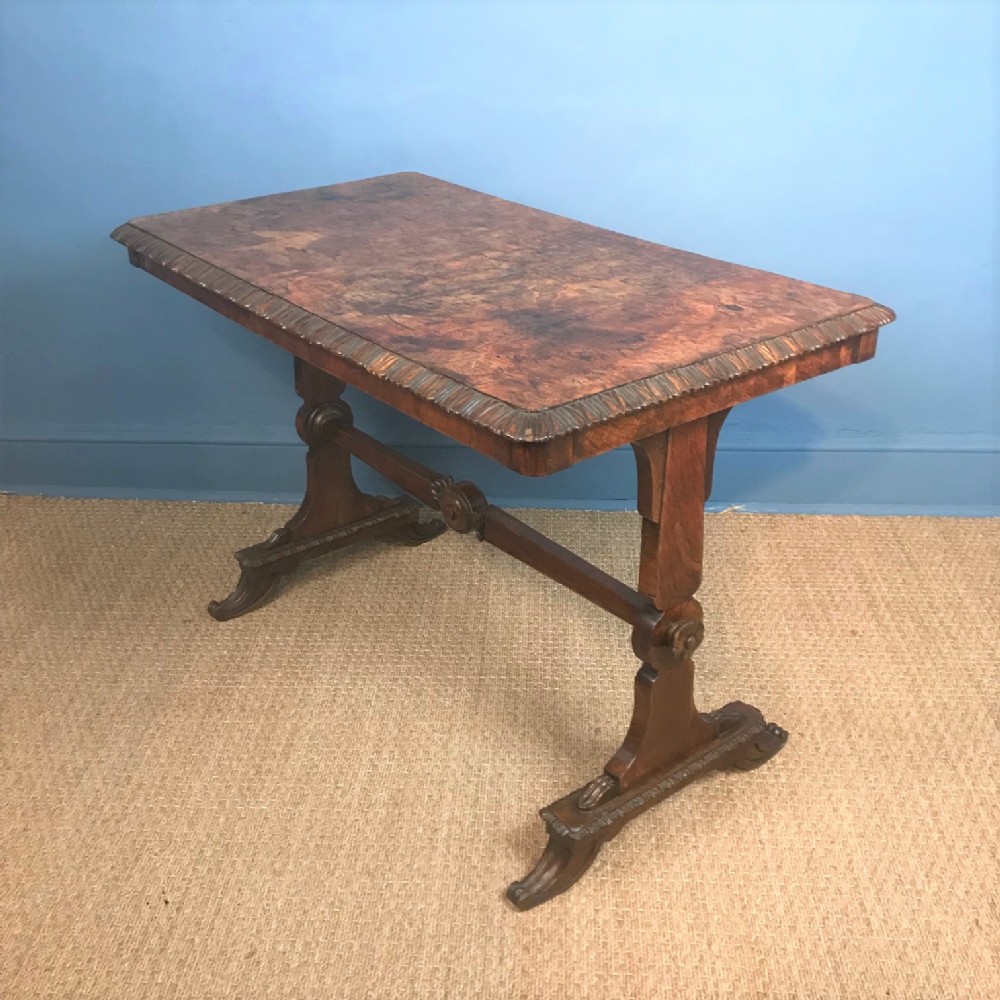 A William IV burr elm writing table circa 1835