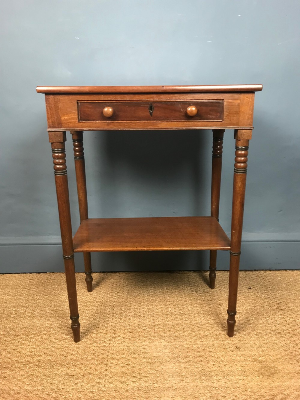 A George IV mahogany two tier table circa 1830