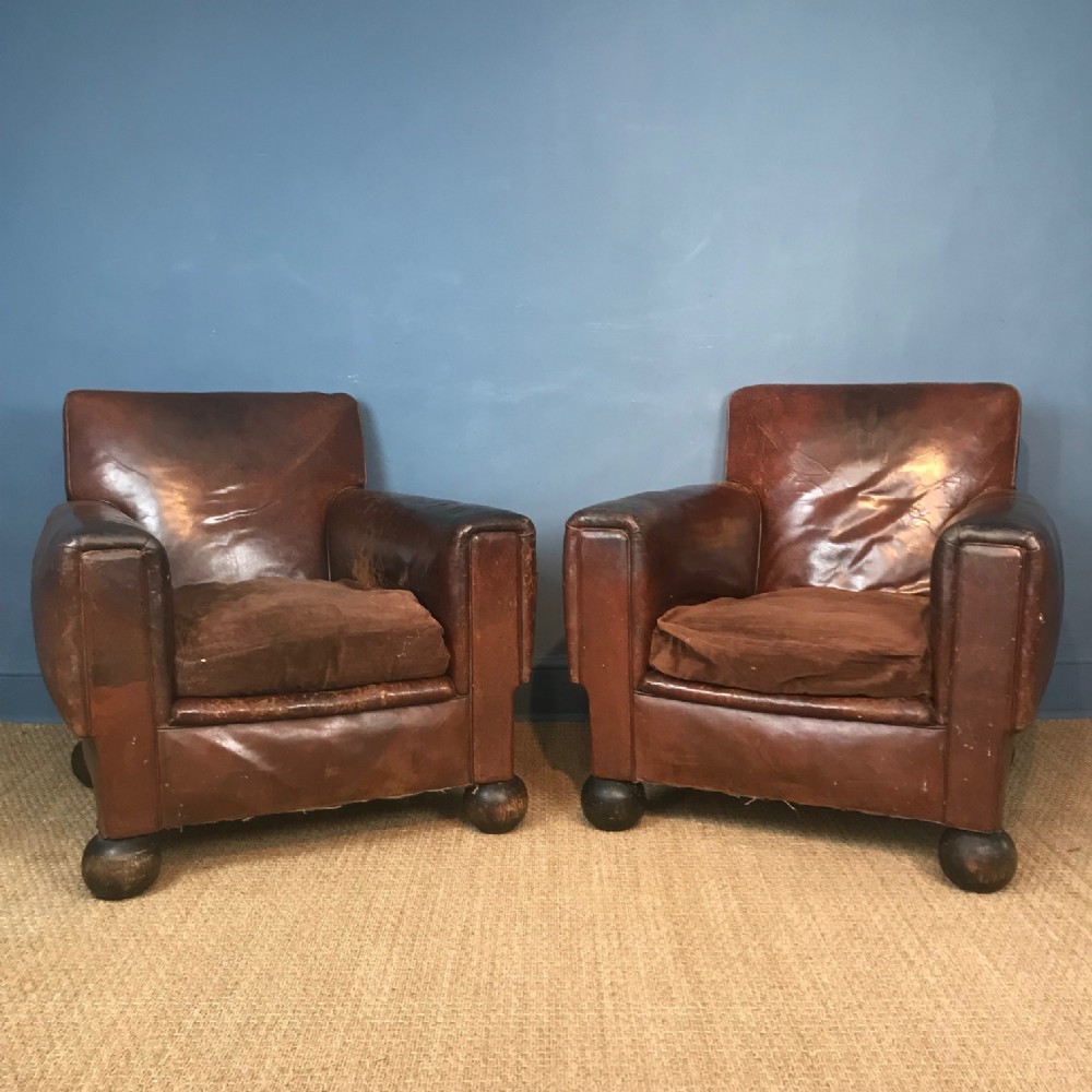A pair of English leather club chairs by Cowleys circa 1930