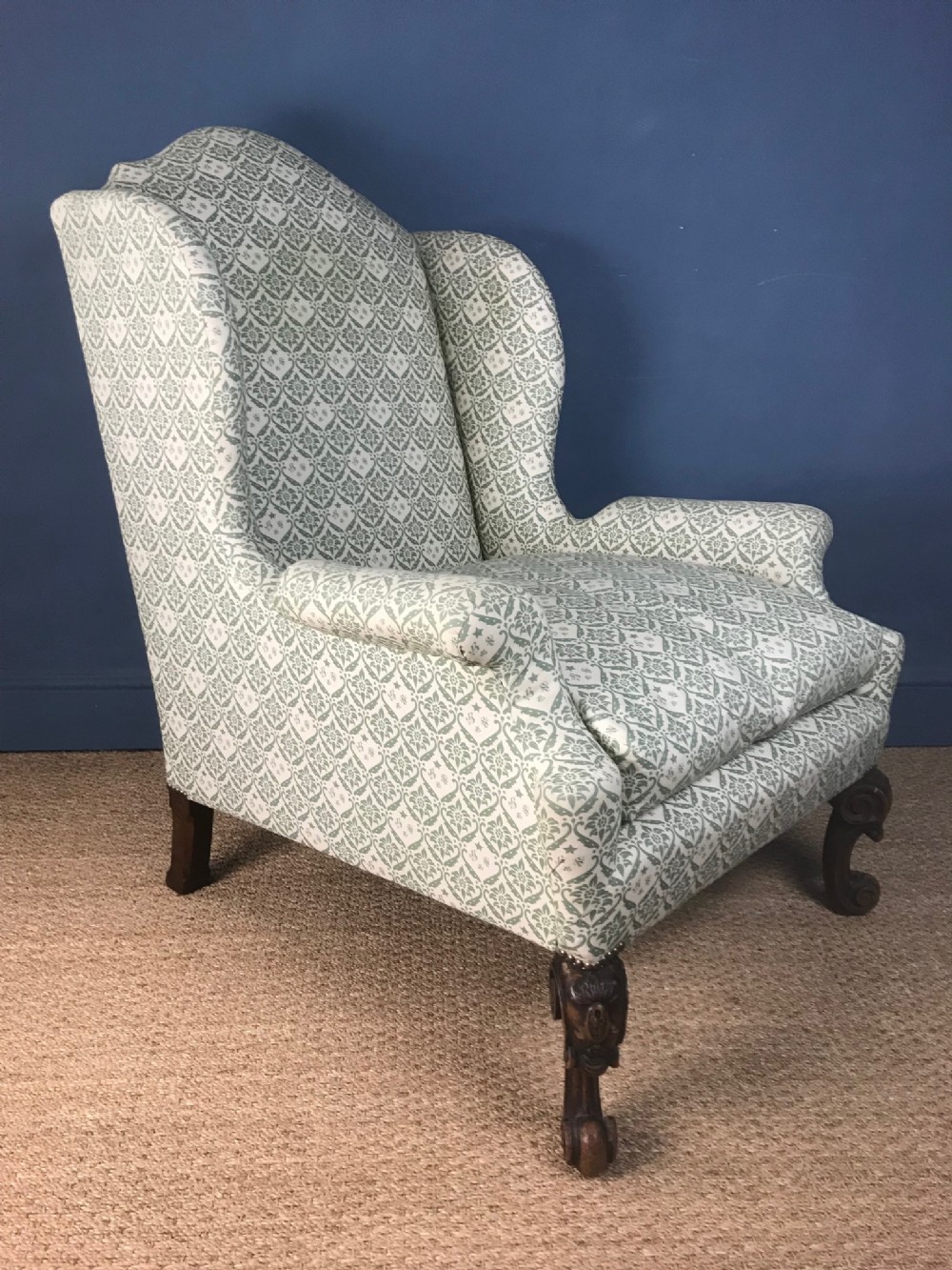 A large Howard and Sons Edwardian wing armchair circa 1910