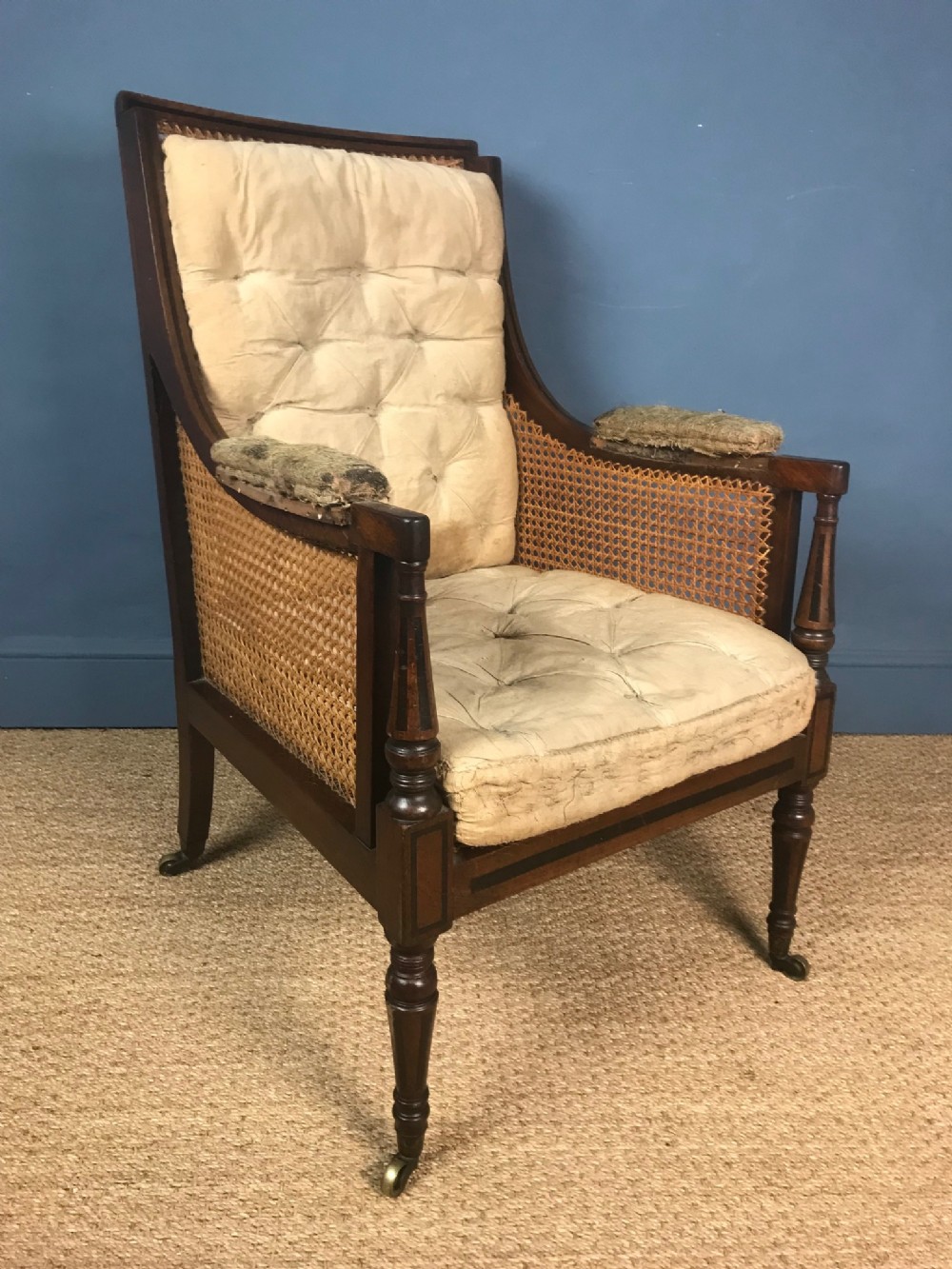 A George IV mahogany and ebony inlaid library bergere chair circa 1825 