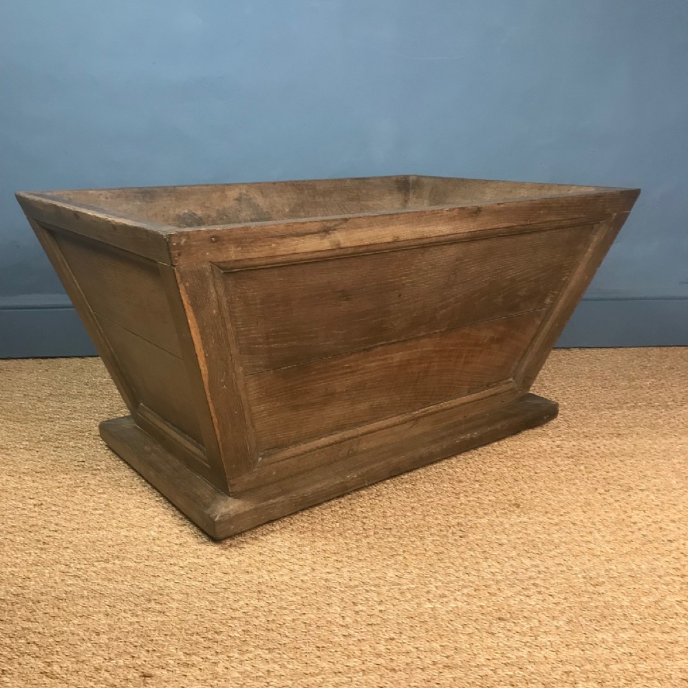 A large mid 19th c oak sarcophagus log basket or wine cooler circa 1850