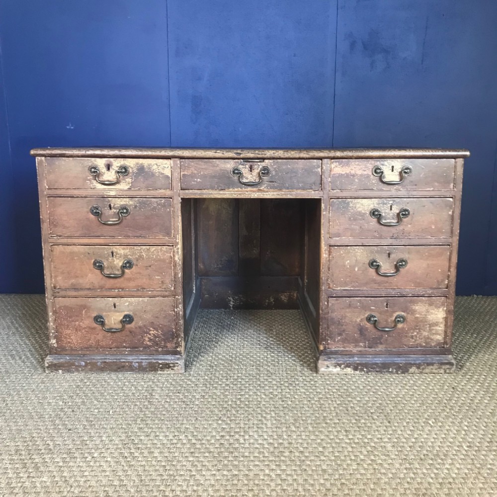 A late Georgian pine estate desk circa 1830