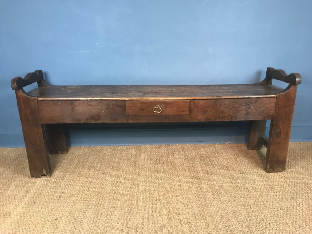 A large 19th c French elm hall bench