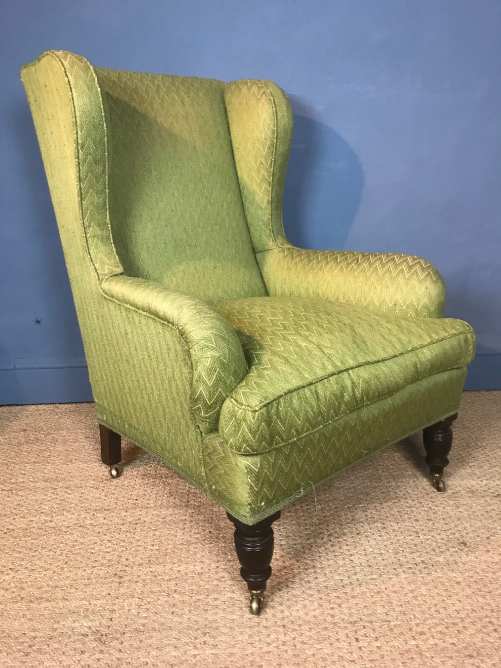 A large Victorian wing armchair circa 1890