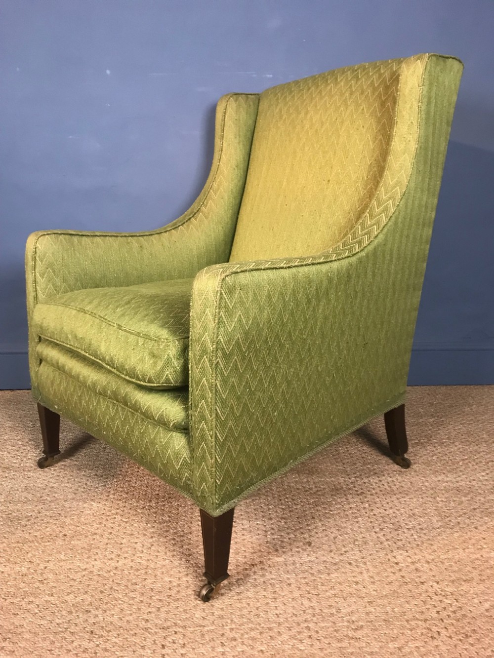 An Edwardian mahogany wing armchair circa 1910
