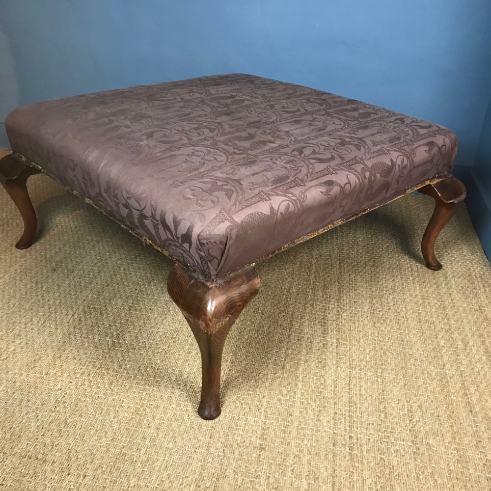 A very large 1920`s oak stool on cabriole legs