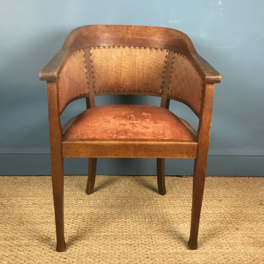 A stylish English oak desk chair circa 1925