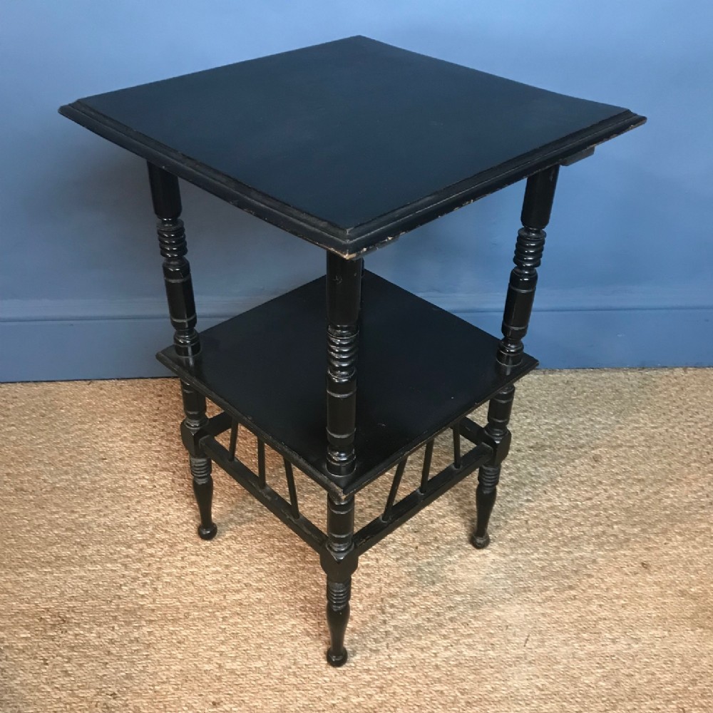 An Aesthetic Movement ebonised 2 tier table circa 1880 to a design by E W Godwin