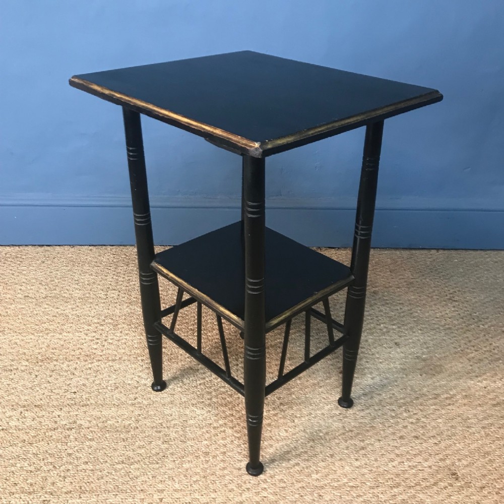 An Aesthetic Movement ebonised and parcel gilt 2 tier Godwin table c 1880