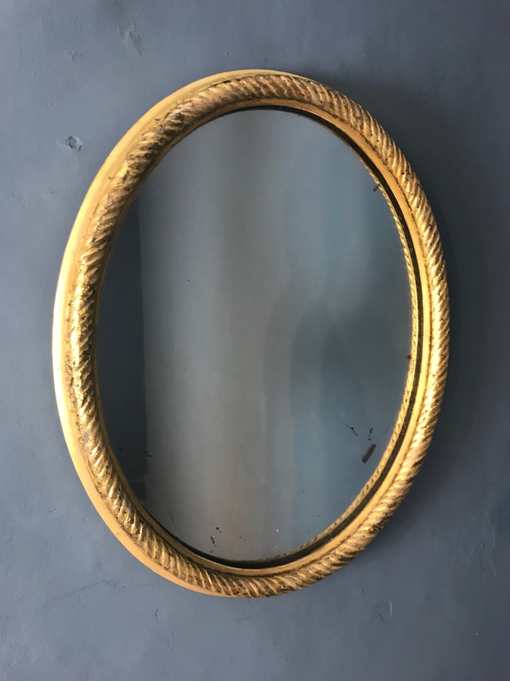 A small Regency water gilded oval mirror c 1810 