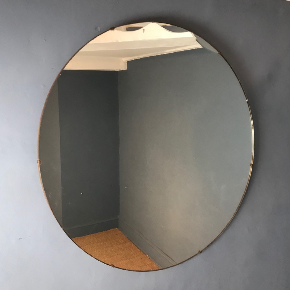 A large English Circular Art Deco Mirror c 1930