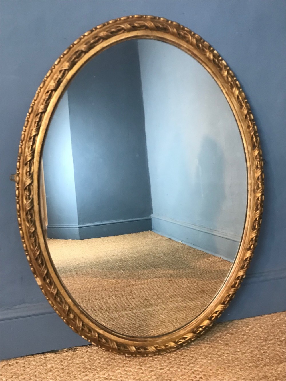 A large mid 19th c English gilt oval mirror circa 1860