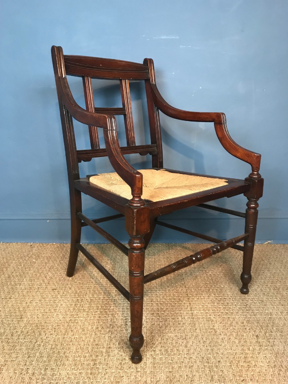 An Aesthetic Movement walnut armchair circa 1890