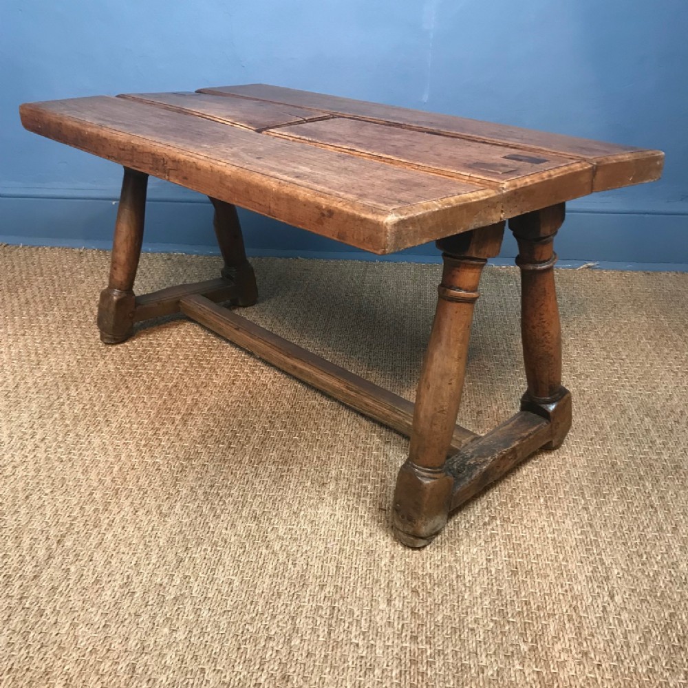 A French walnut low table late 19th c on turned legs