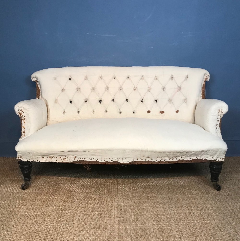 A Victorian ebonised mahogany small sofa circa 1880