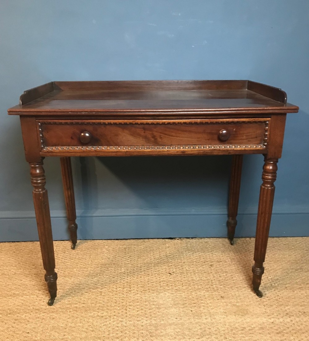 A Regency mahogany side table circa 1820 in the manner of Gillows.