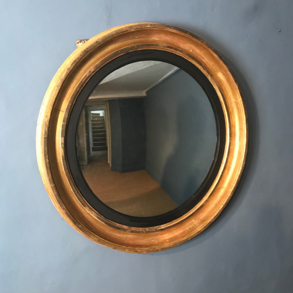 A large Regency Convex Mirror circa 1820 with original water gilding and mercury plate