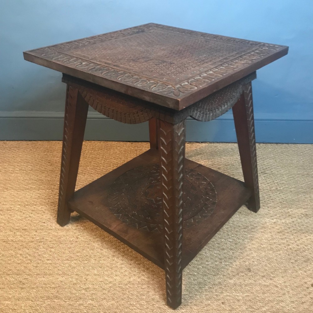An Anglo Indian Teak table chip carved in arts and crafts style circa 1900
